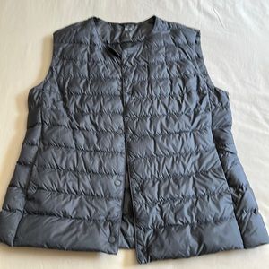 Uniqlo ultra light down vest in a bluish grey